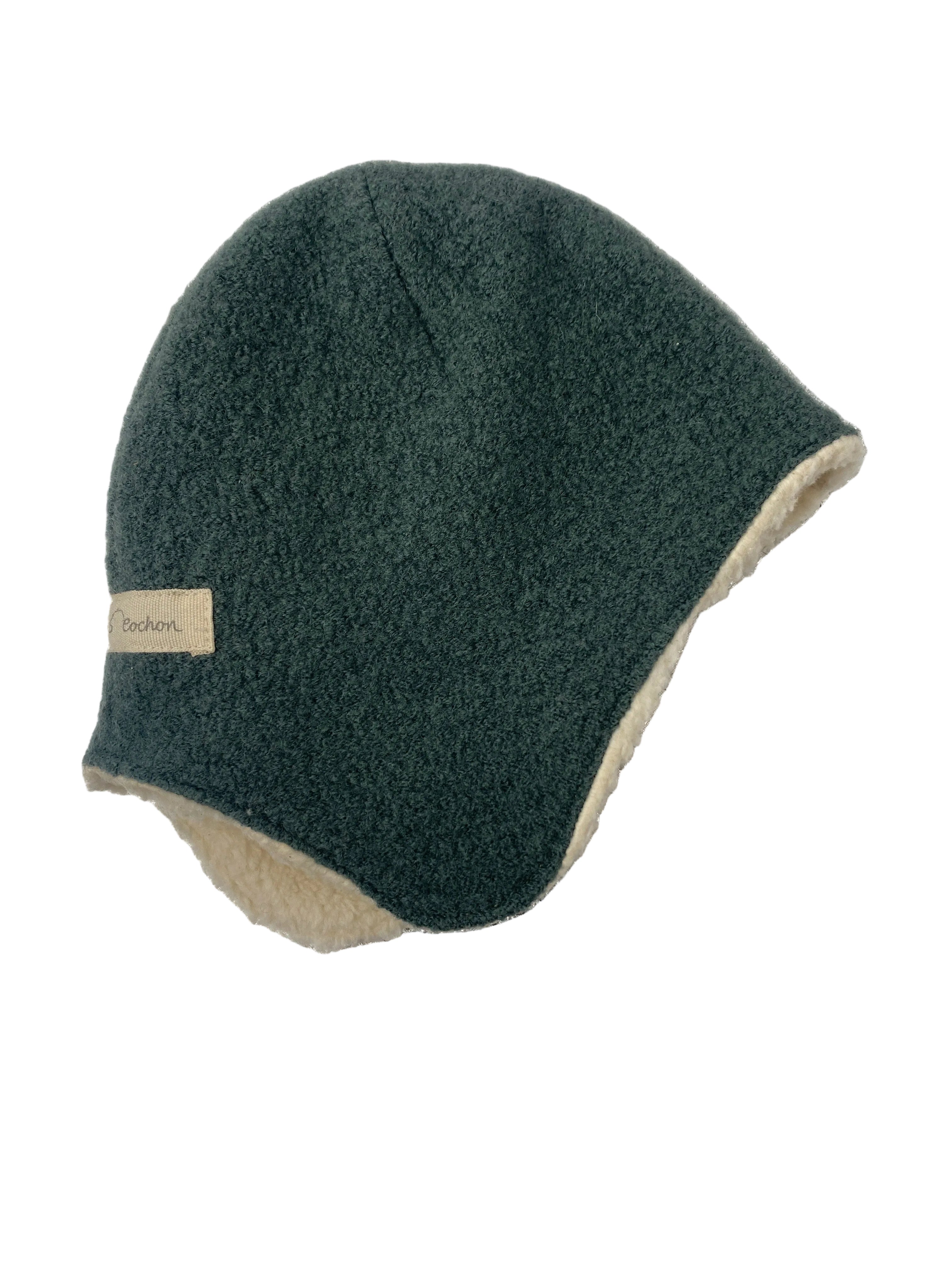 Wollwalk Mütze Jade mit Teddyfutter Gr 3M: Wintermütze mit dunkelgrünem, strukturiertem Stoff und cremefarbenem Fleece-Futter, bedeckt den Kopf und Ohren für extra Wärme. Zustand: neu.