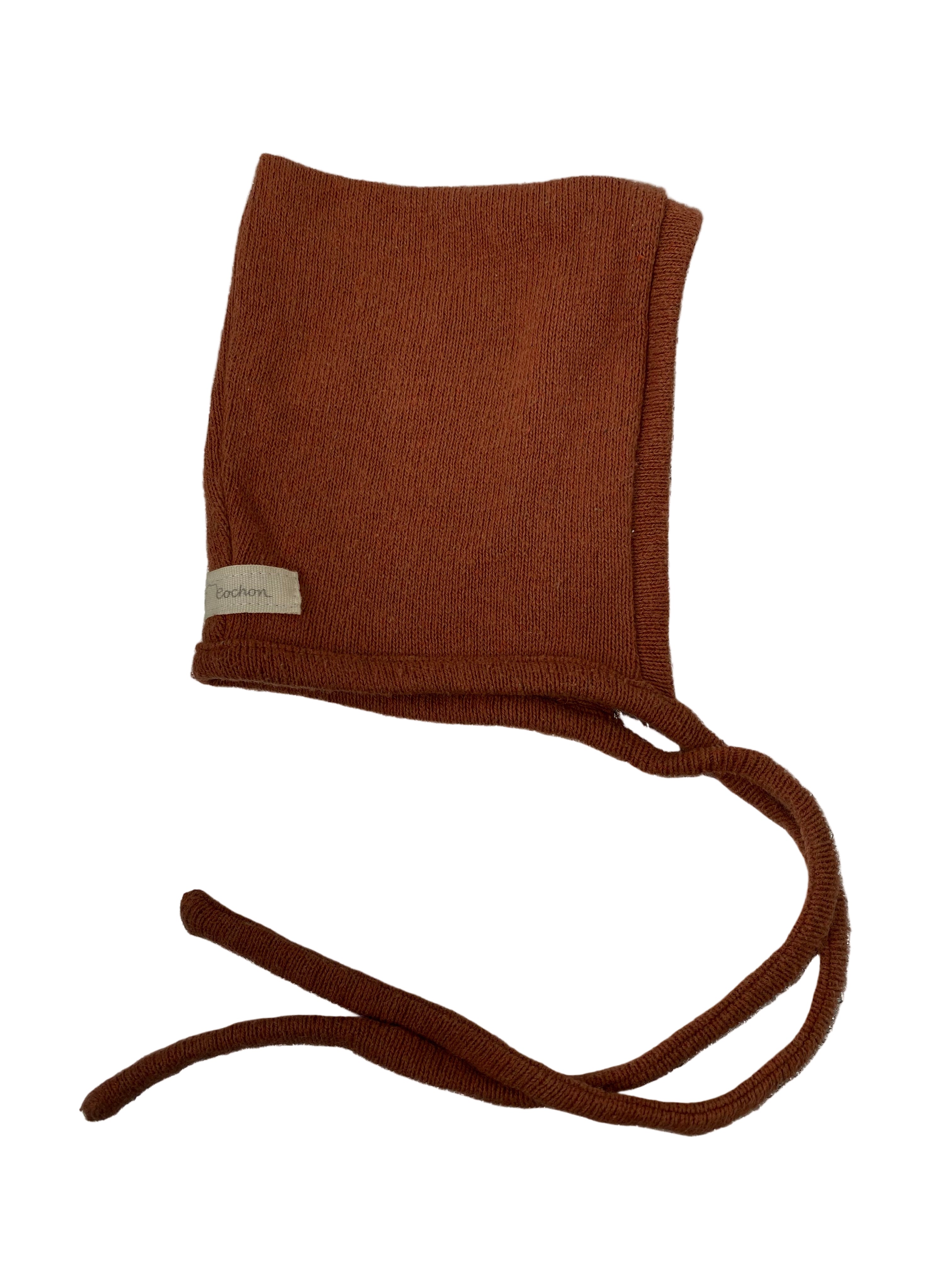 Zwergenmütze Strick Rost Gr 0M-6M: Handgestrickte Babymütze mit quadratischer Krone und langen Bändern zum Binden; kleines Stofflabel am Rand. Zustand: gut.