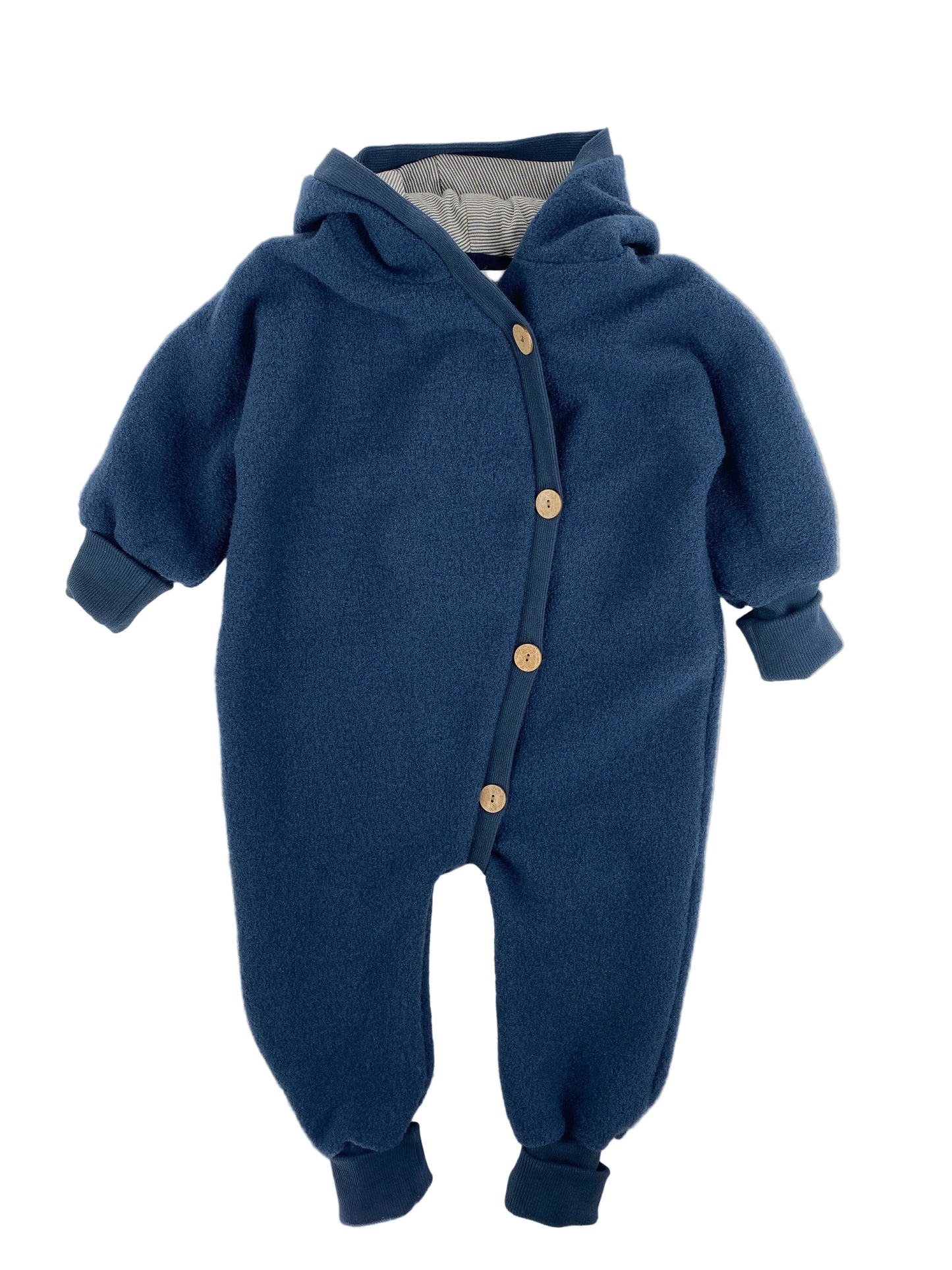 Babyknicker Sweat Cremepuder Gr Mini: Ein einteiliger, fleeceartiger Baby-Strampler mit Kapuze, langen Ärmeln, gerippten Bündchen und diagonalen Knöpfen. Zustand: sehr gut.