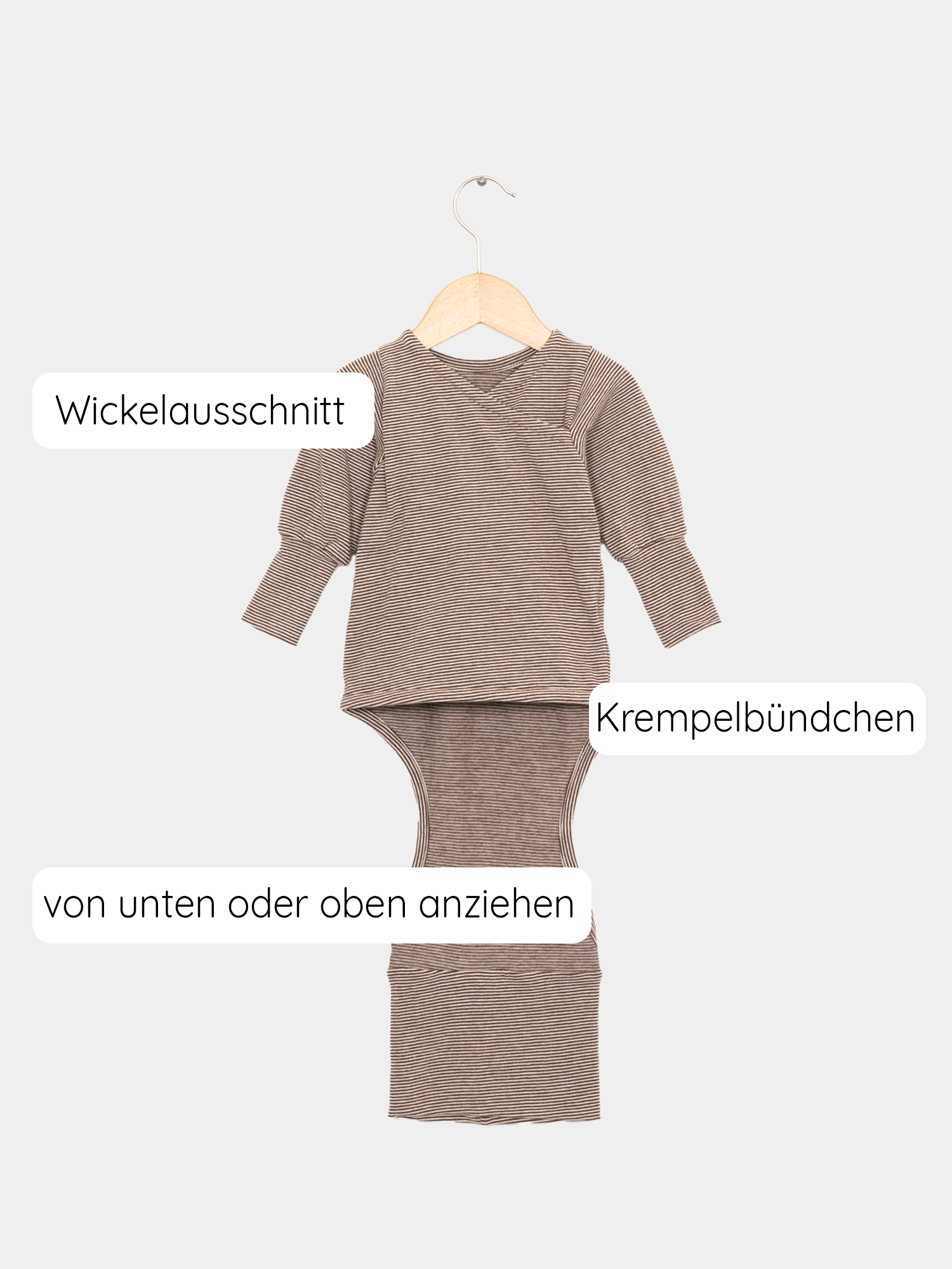 Loopbody Bio-Ringel - Schoko-Ringel auf einer Schaukel. Der Babybody aus weicher Bio-Baumwolle zeigt ein gestreiftes Muster und wächst bis zu einem Jahr mit.