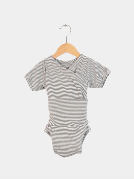 The short-sleeve organic cotton Loopbody – Ringel Maus features a gray-and-white striped baby bodysuit hanging on a wooden hanger, ideal for warm summer days thanks to its breathable bamboo fabric.