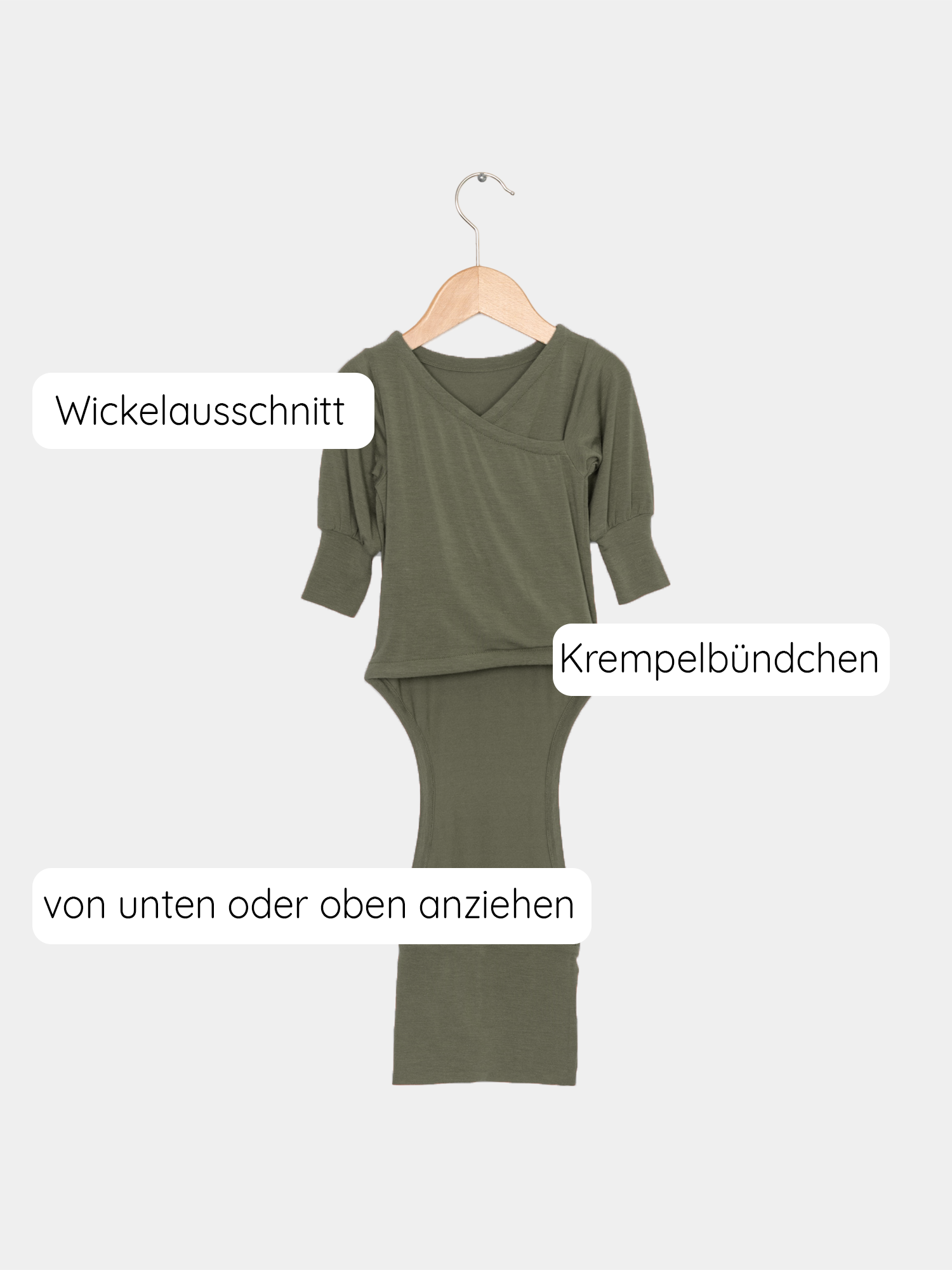 Loopbody Kaschmir-Mix - Avocado: Grüner Langarmbody ohne Knöpfe, aus atmungsaktivem Kaschmir-Micromodal-Mix, auf einem Kleiderbügel präsentiert. Baby Body für Erstausstattung Baby.