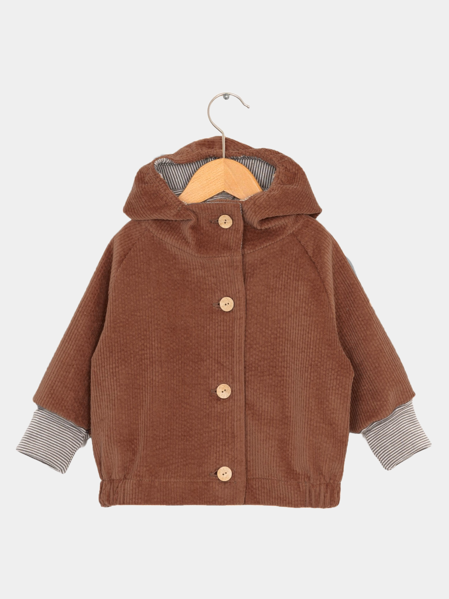 Wichteljacke Breitcord - Rost: Nahaufnahme eines braunen Breitcordärmels, gestreifte Kapuze. Weiche, robuste Jacke mit mitwachsenden Ärmeln, ideal für Kinder, mit großer Tasche für Schätze.