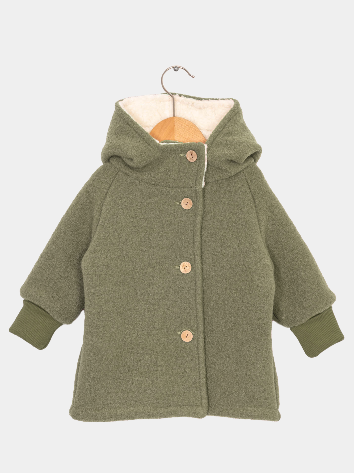 Teddy-Wichteljacke Wollwalk - Pistazie mit weißem Teddyfutter, grüner Strickmanschette, Knopf und Haken, ideal für kalte Wintertage und wächst mit dem Kind mit.