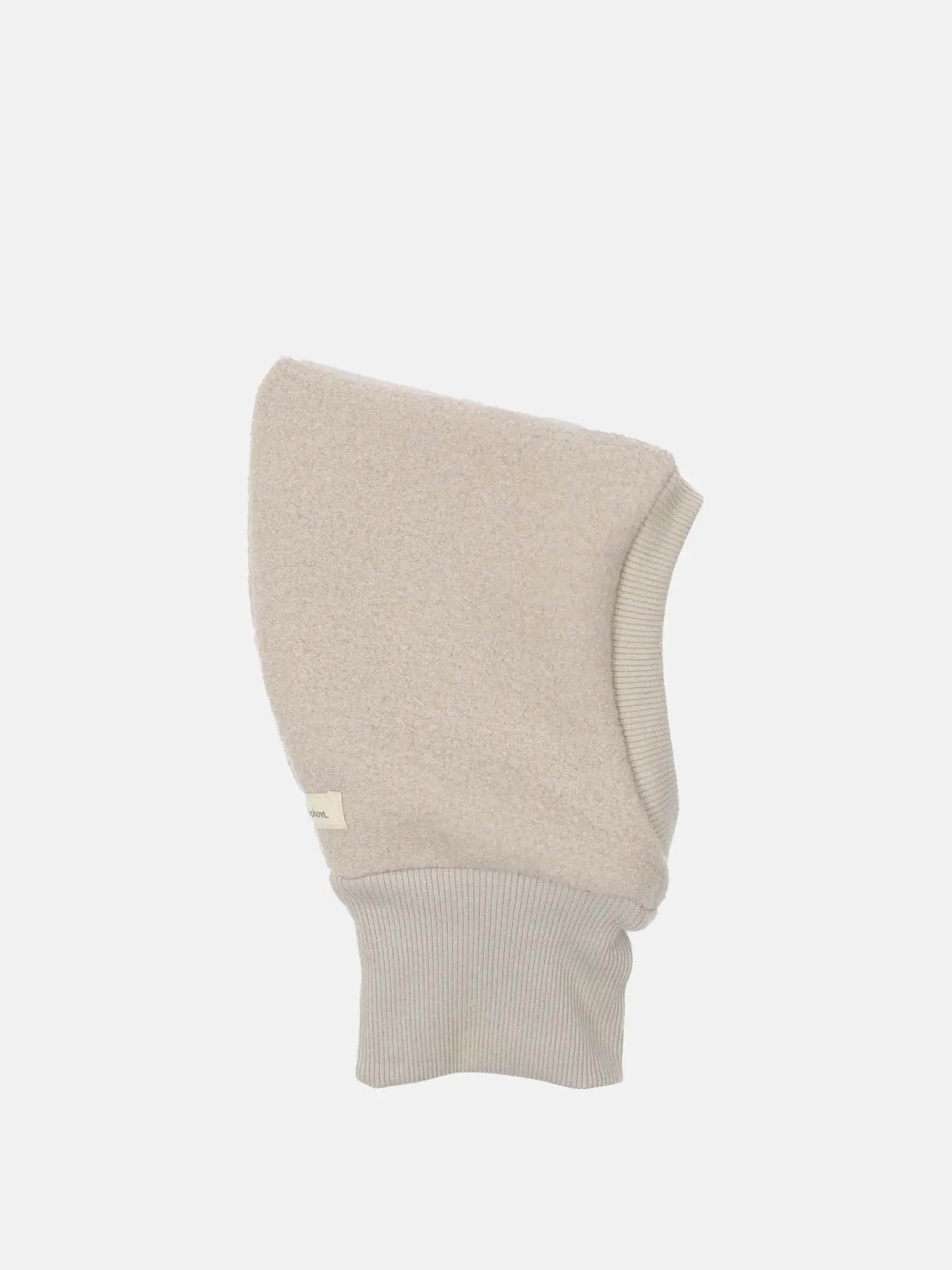 Schlupfmütze Wollwalk Sand Gr. 2-4/5Y: Einteiliges, kapuzenartiges Winterkopftuch in hellbeige mit weichem Fleece-Körper und geripptem Strickbündchen um die Gesicht-/Halsöffnung, Zustand neu, mit kleinem Loch im Bündchen.
