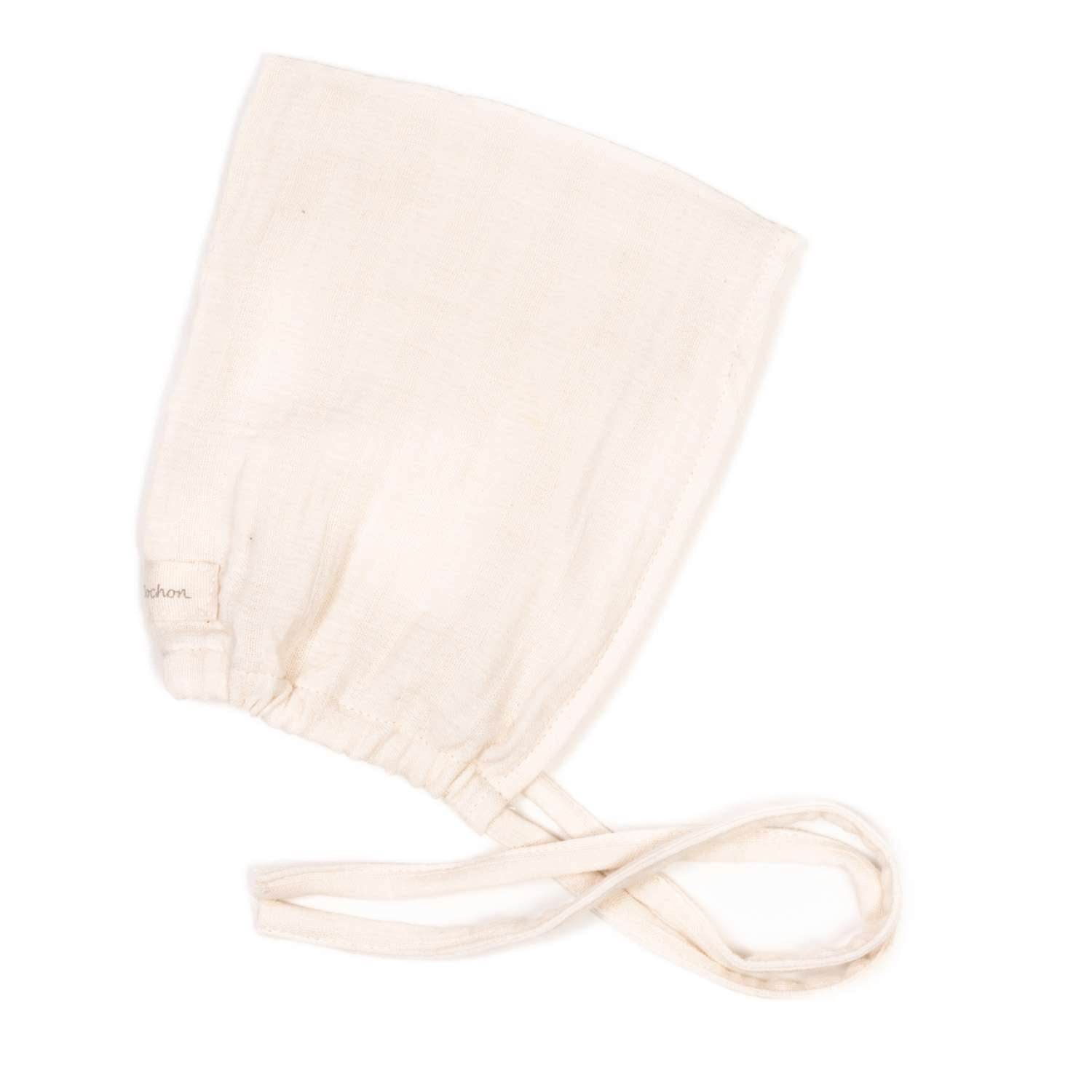 Zwergenmütze Bio Musselin Natur Gr. 3M in sehr gutem Zustand, zeigt feines Musselin-Material, ideal für Babys. Die Mütze präsentiert sich in natürlichem Design und ist für 3 Monate alte Kinder geeignet.