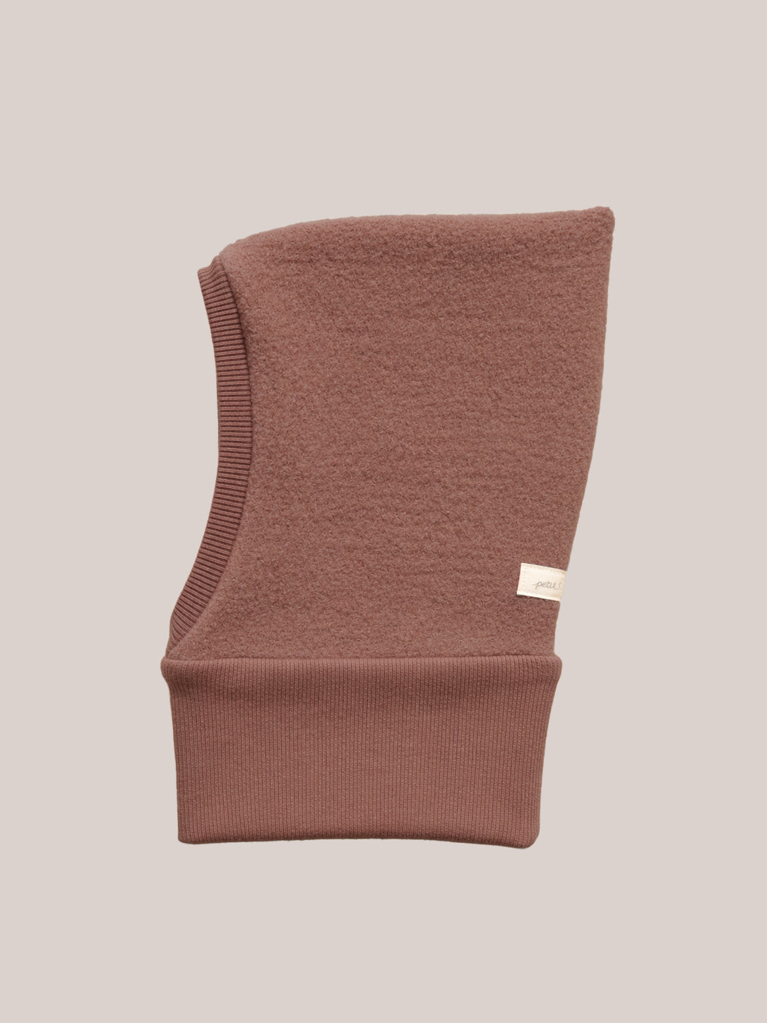 petit cochon Schlupfmütze aus altrosa Wollwalk mit weichem Bio-Jersey-Futter für Kinder
