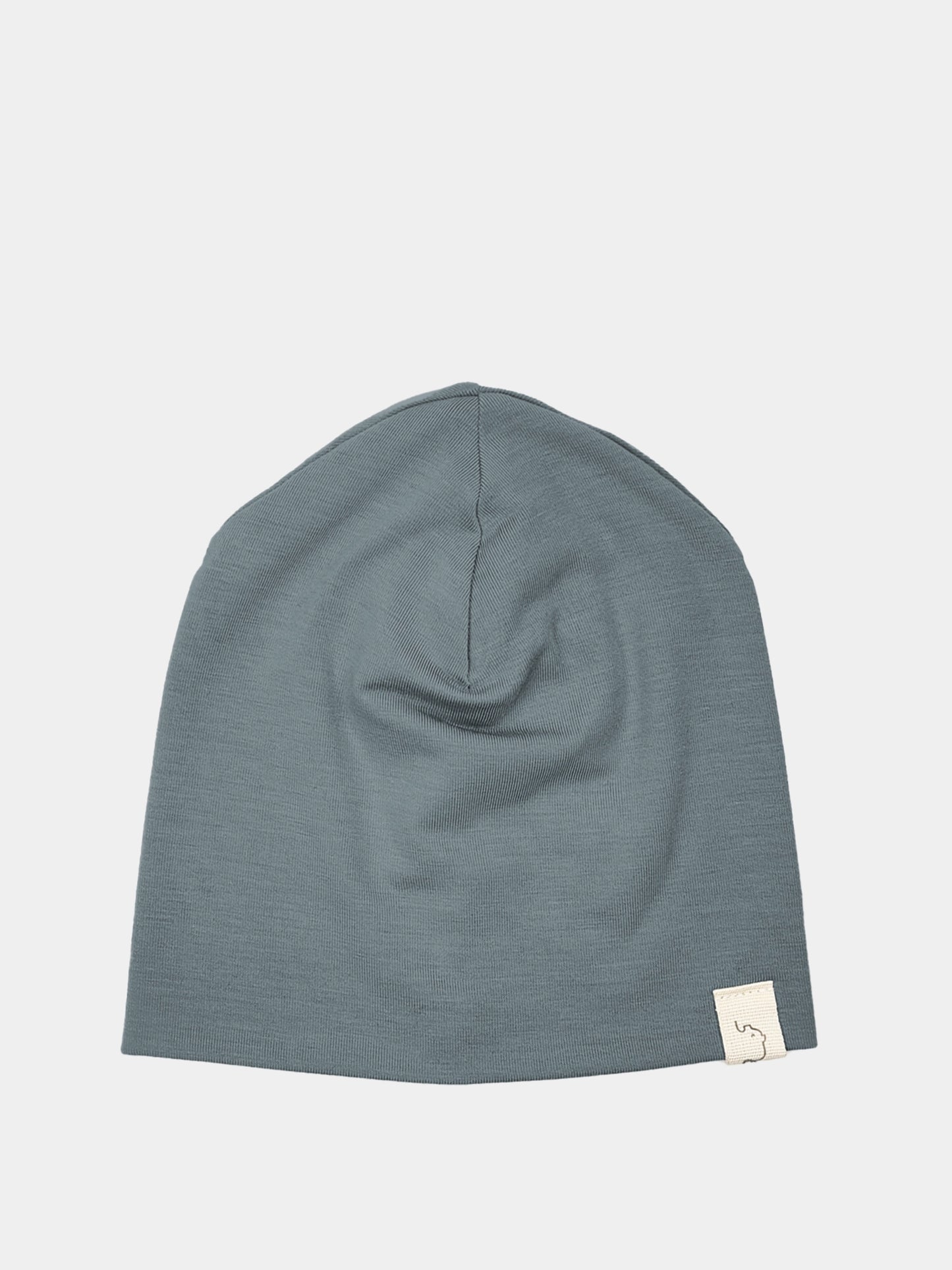 Graue Beanie Kaschmir-Mix - Taube mit weißem Label, ideal für kühle Jahreszeiten, weich und handgefertigt in Berlin. Perfekt unter Helmen und Kapuzen.